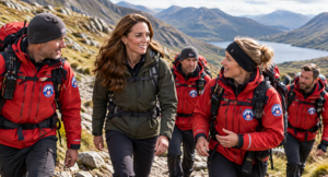 Kate Middleton hiking with members of a mountain rescue team on a rugged mountain trail
